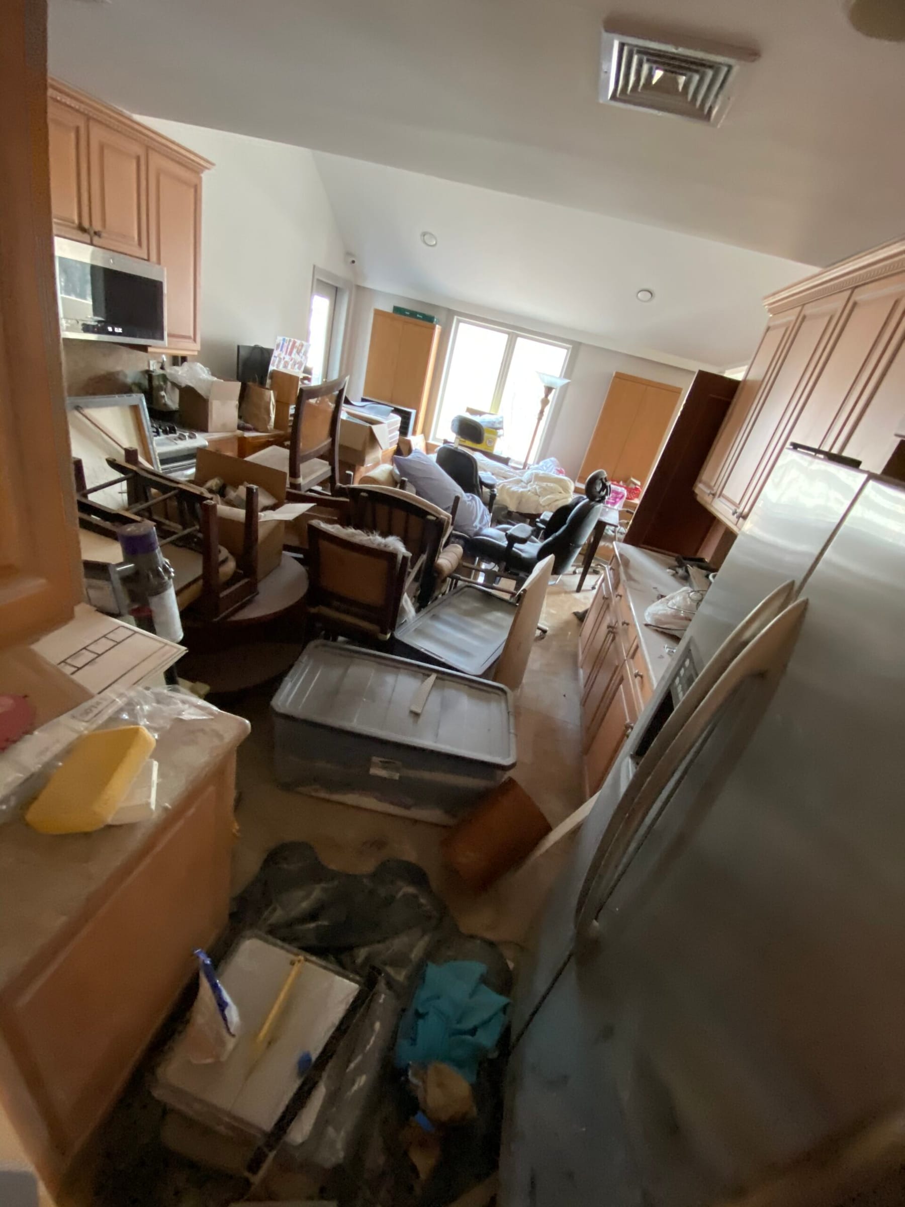 Before: cluttered kitchen and living room