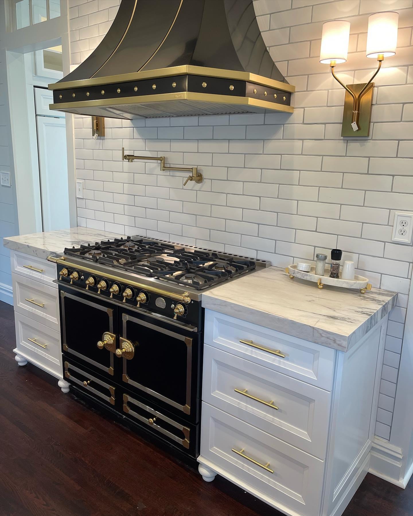 Black & brass range, detailed to the tile