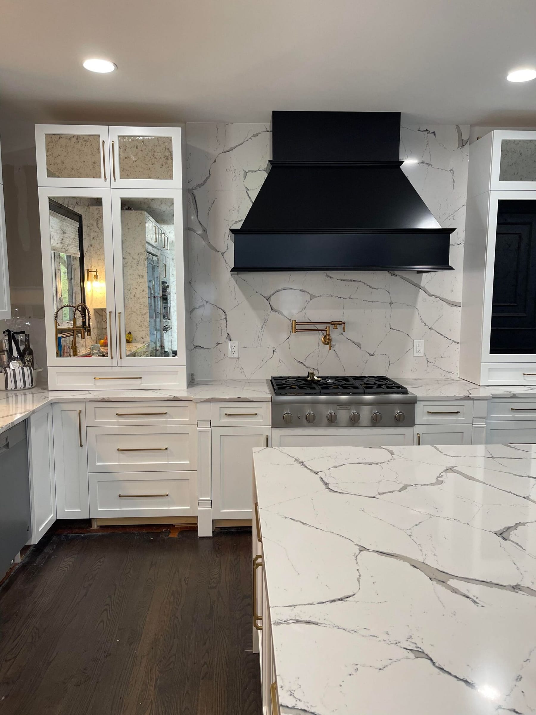 Quartz-slab kitchen, mirror-finish clean