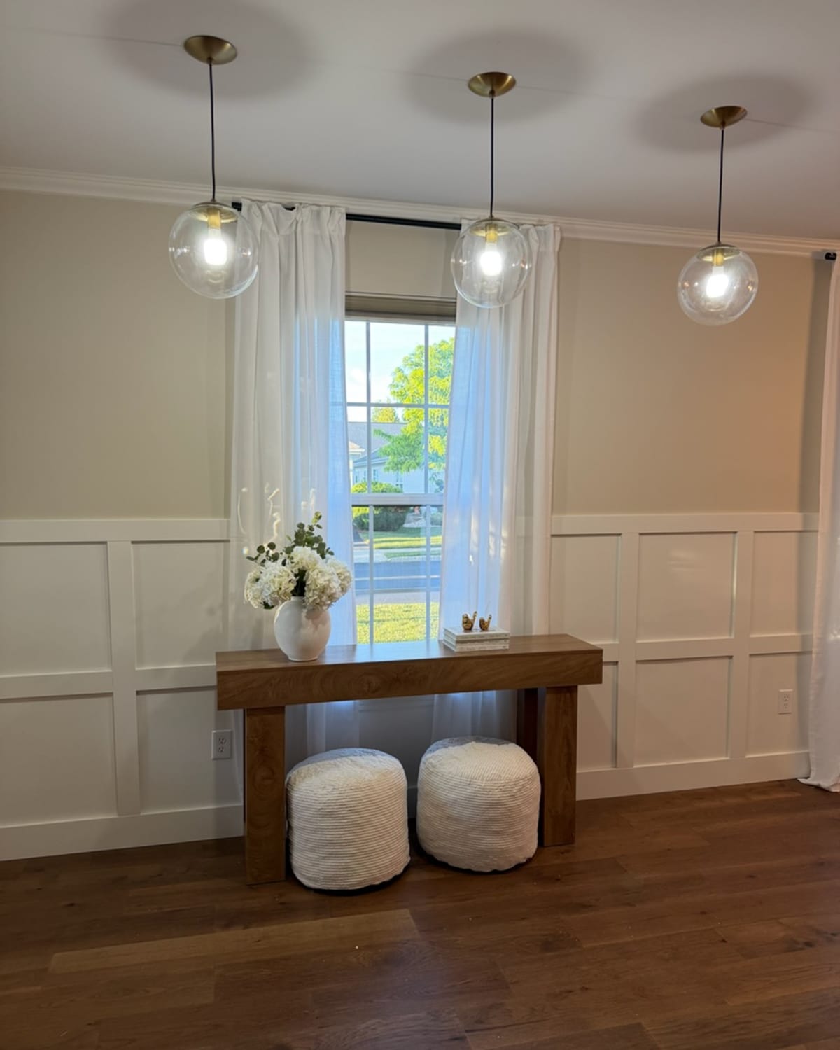 Dining room with board-and-batten wainscoting, dusted