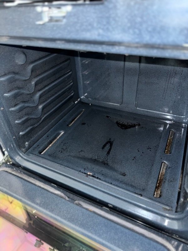 Oven bottom, scrubbing off the burnt-on residue